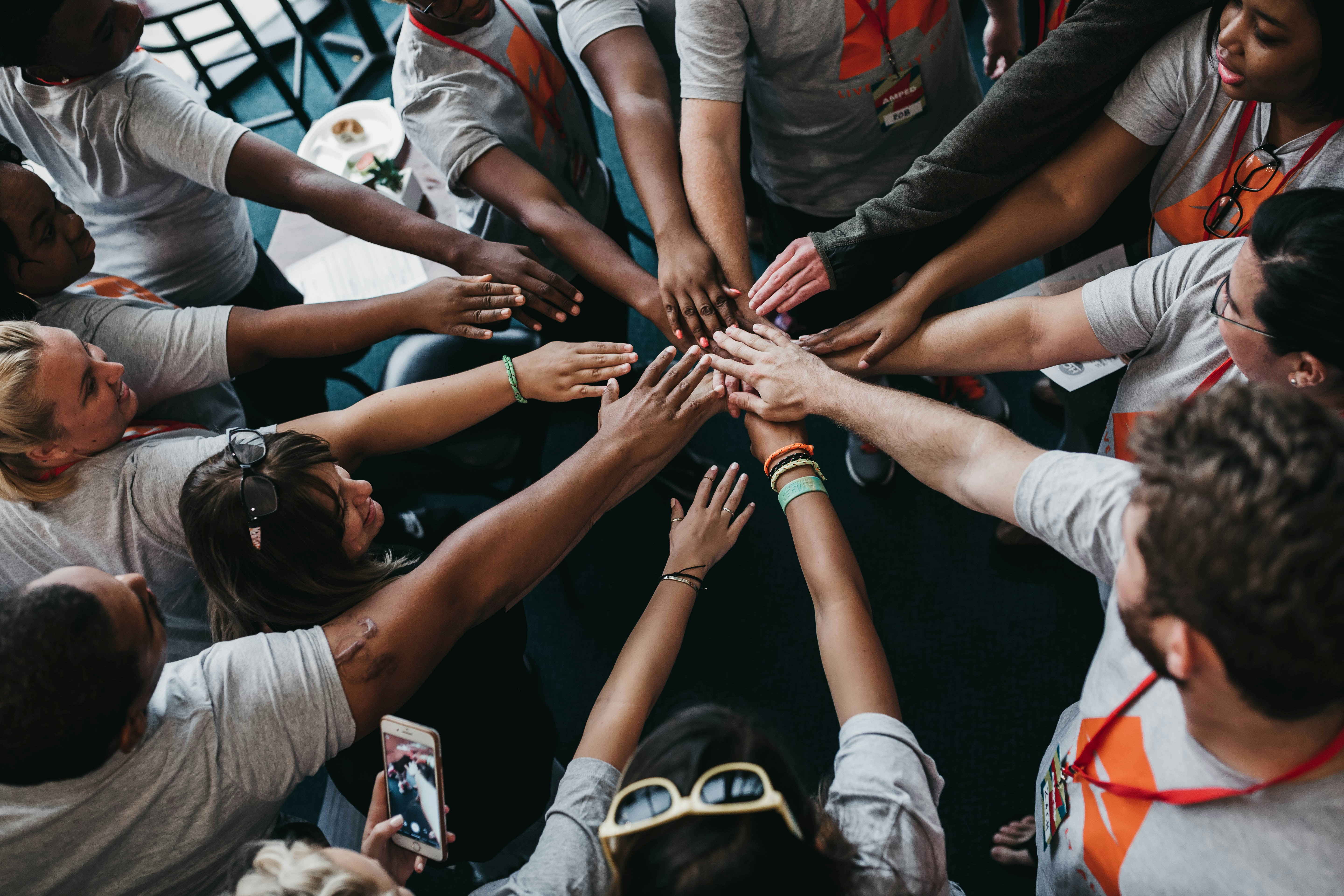 Community members joining hands in support